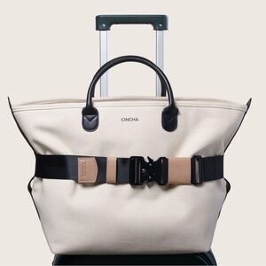 Cincha travel belt stretch black with toffee tan beige brown accents NWOT